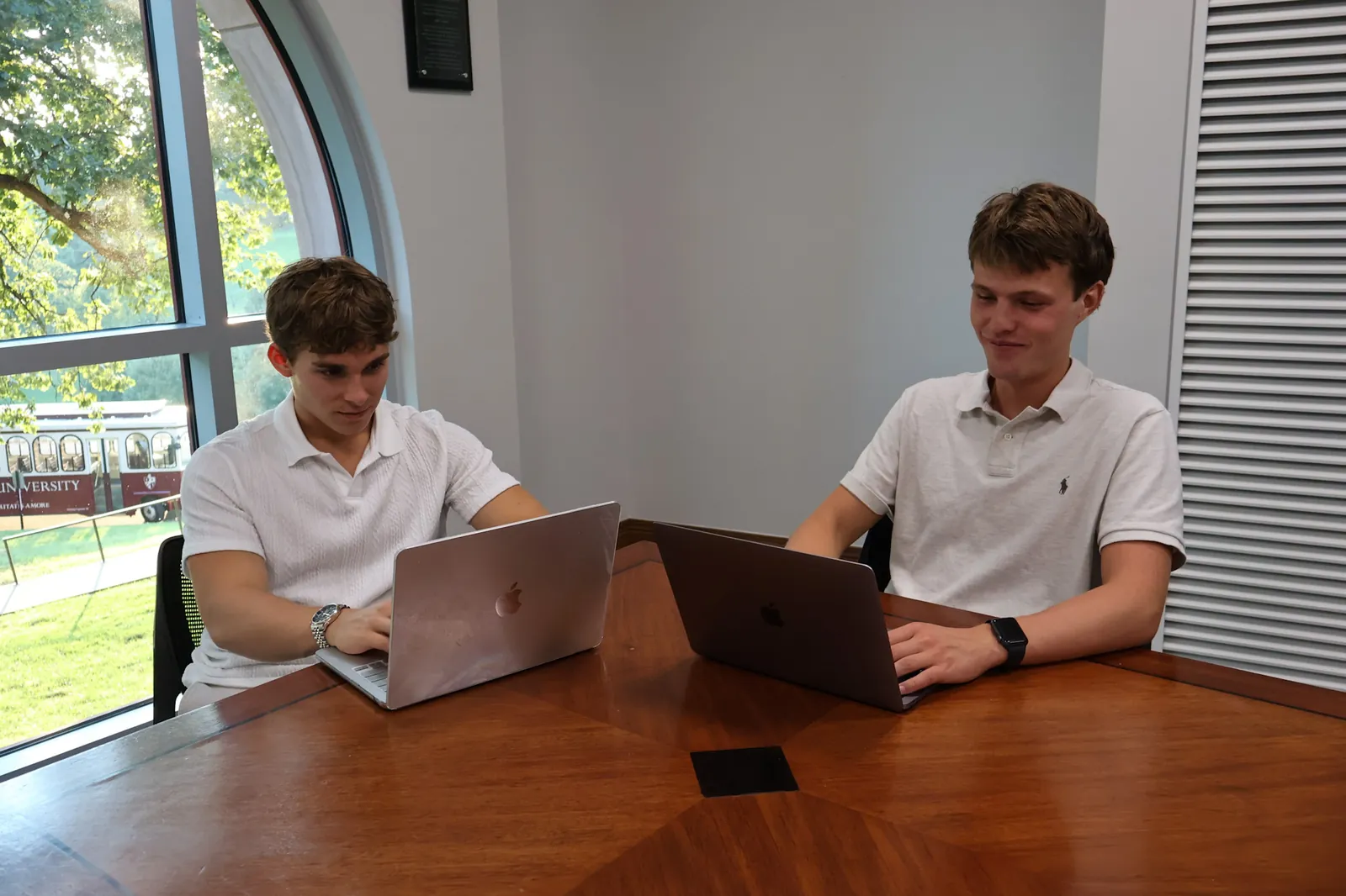Jack Moutardier and Daxton Noe working at the New Albany office